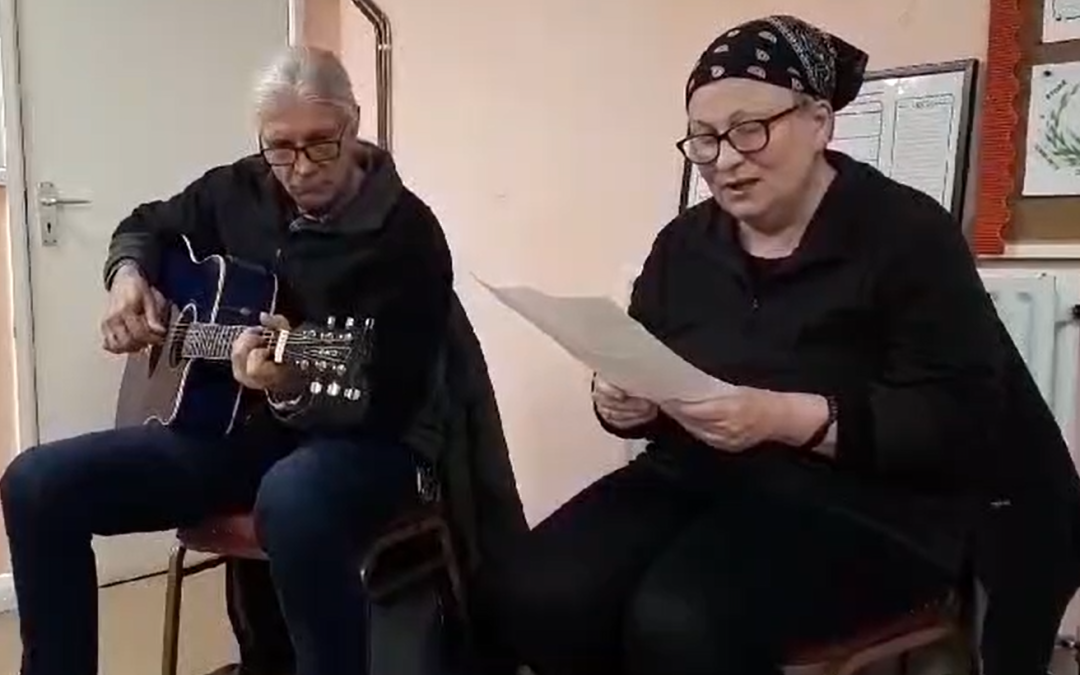 An old man sitting on his own